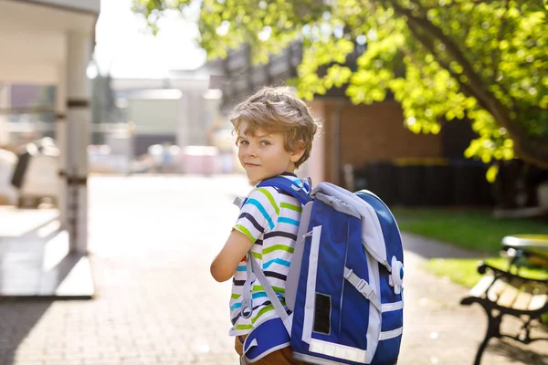 Little kid boy with school satchel on first day to school — Stock Photo, Image