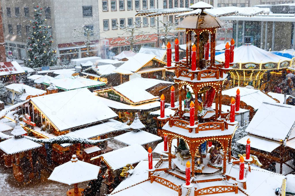 Traditional German christmas market in the historic center of Nuremberg, Germany during snow