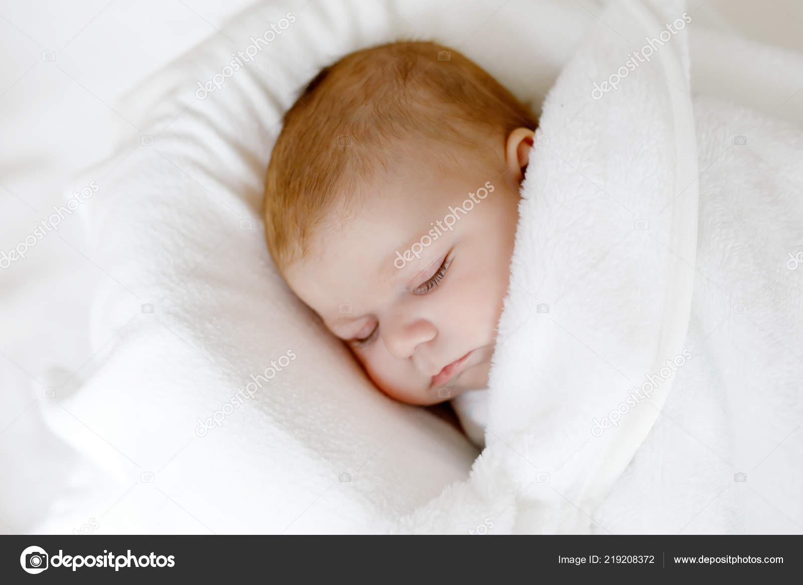 Cute Little Newborn Baby Girl Sleeping Wrapped In Blanket Stock