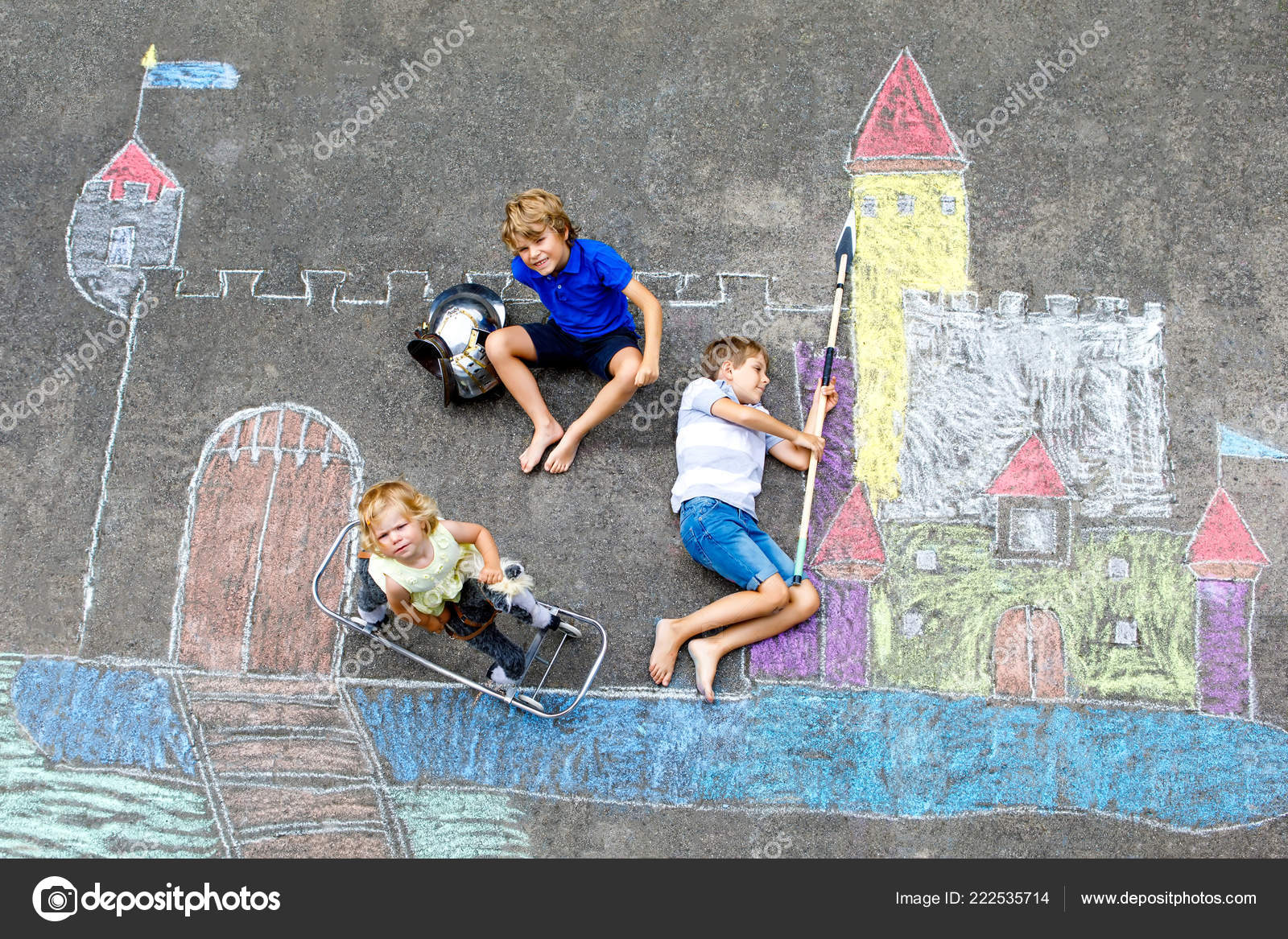 Two Little Kids Boys And Cute Toddler Girl Drawing Knight Castle With Colorful Chalks On Asphalt Happy Siblings And Friends Having Fun With Creating Chalk Picture And Painting Stock Photo By C Romrodinka