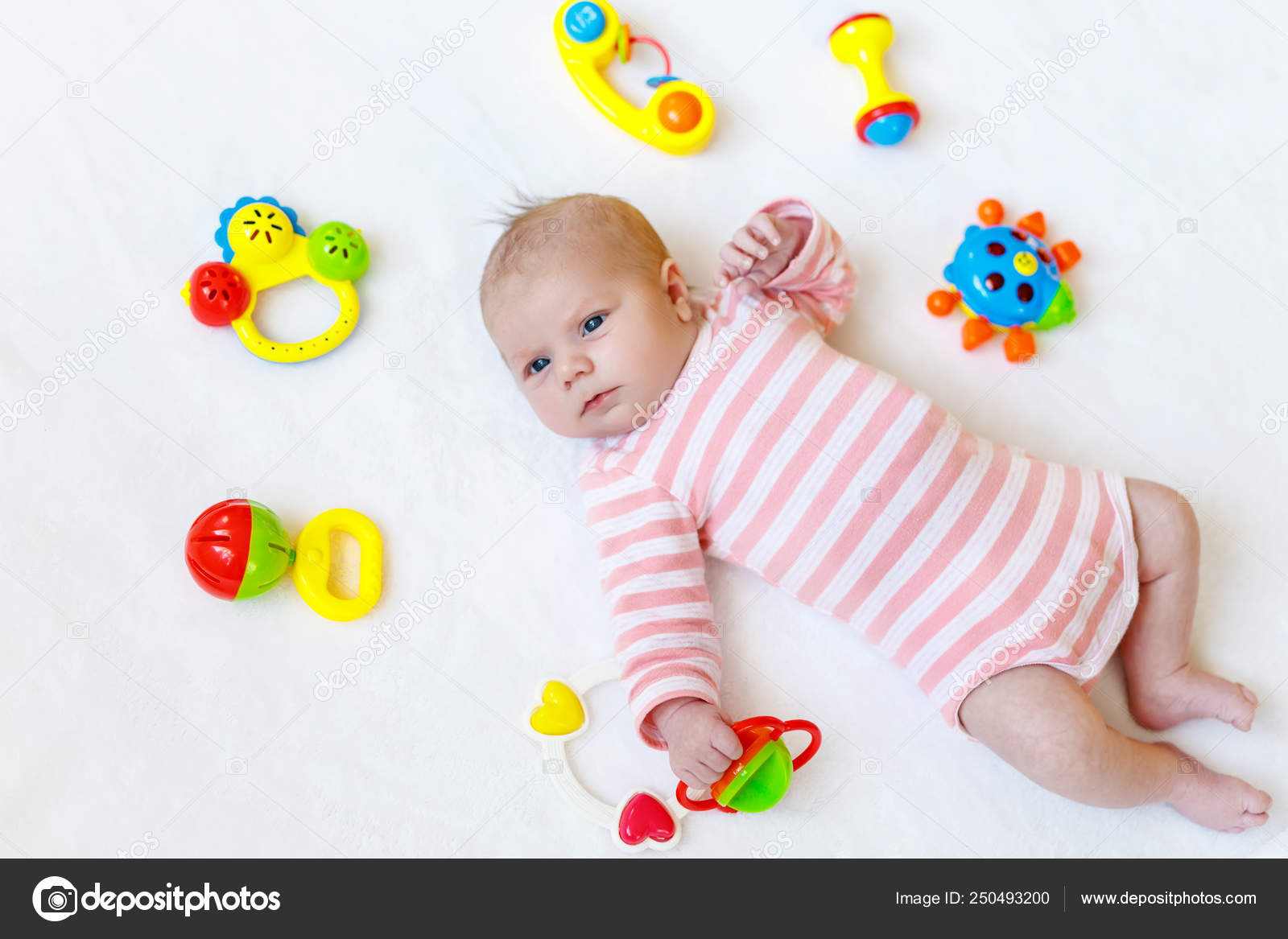 newborn baby playing toys