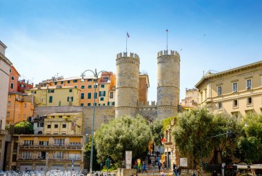 Genova, Genoa, Italy - April 18, 2019: Charming streets of Genoa, Italy. Old famous city of Italy, with beautiful architecture, houses, roofs, buildings on sunny day. clipart