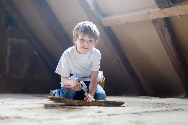 Little kid boy helping with toy tools on construciton site. — Stock Photo, Image