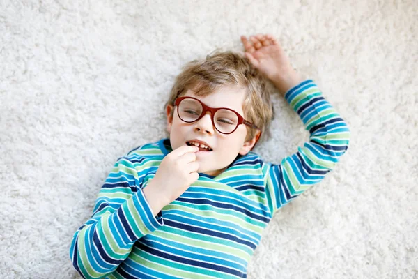 Close-up portrait of little blond kid boy with brown eyeglasses — Stock Photo, Image