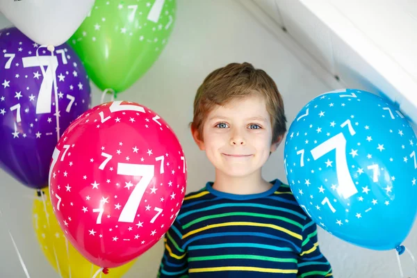 Portrait of happy kid boy with bunch on colorful air balloons on 7 birthday — Stock Photo, Image