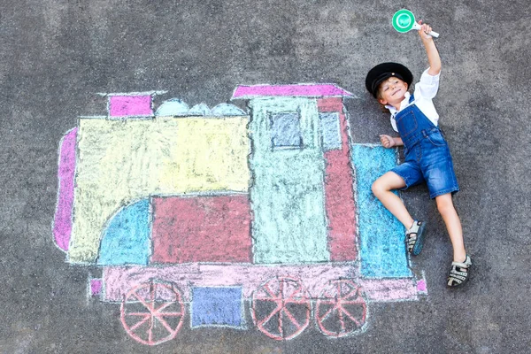 Little kid boy having fun with train chalks picture — Stock Photo, Image
