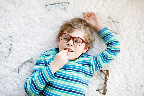 Close-up portrait of little blond kid boy with brown eyeglasses — Stock Photo, Image