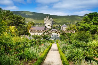 Glenveagh Castle, Donegal in Northern Ireland. Beautiful park and garden in Glenveagh National Park, second largest park of the country. Gleann Bheatha in Irish language clipart