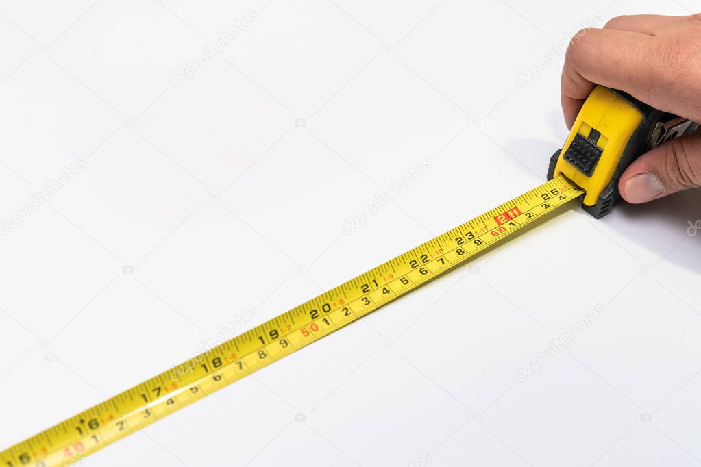 Tape measure on white background close up