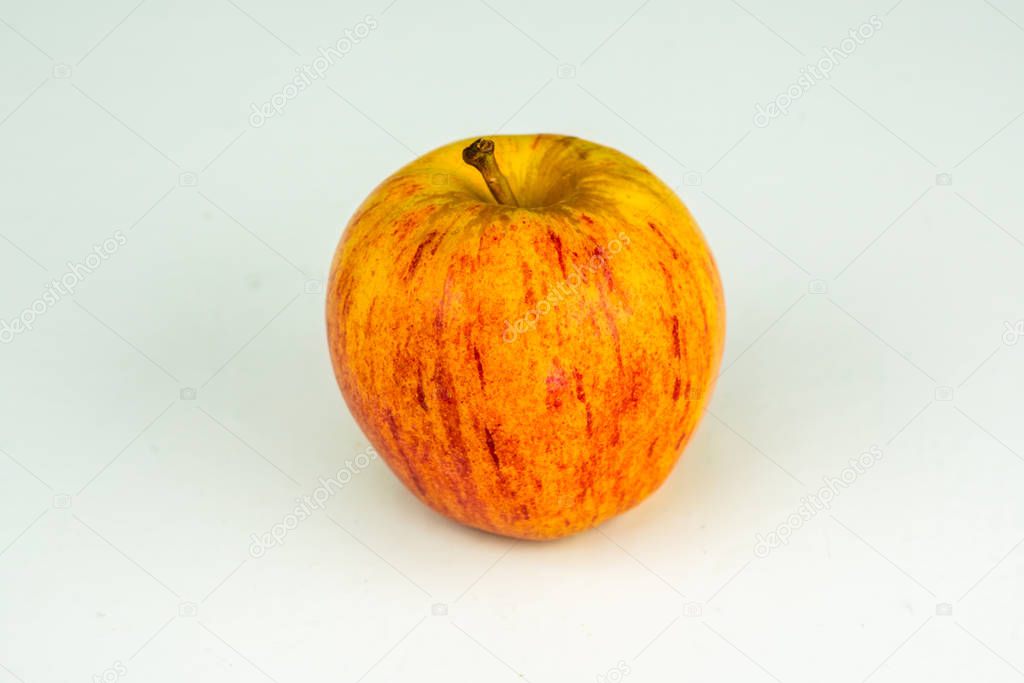 One apple in closeup on a white background