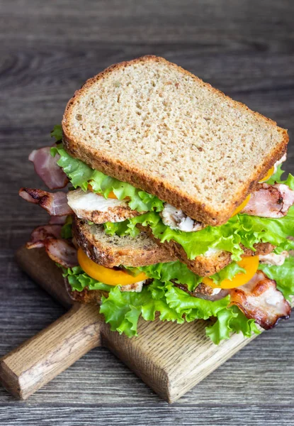 Two Sandwiches Green Salad Grilled Turkey Bacon Vegetables Wooden Cutting — Stock Photo, Image