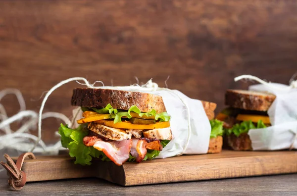 Two Sandwiches Green Salad Grilled Turkey Bacon Vegetables Wooden Cutting — Stock Photo, Image