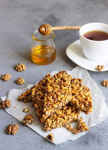 Dessert bars made of walnuts in a honey caramel. Gozinaki - traditional Georgian confection made of caramelized nuts.