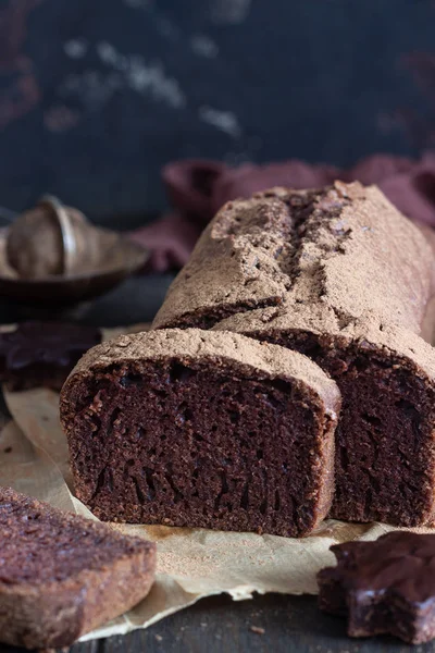 Delicious Dark Chocolate Cake Paper Dark Wooden Background Selective Focus — Stock Photo, Image