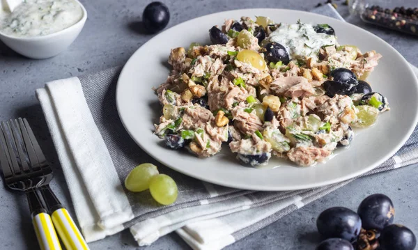 Tuna, green and black grapes salad with natural yogurt dressing. Healthy or food. Light breakfast, lunch or dinner.