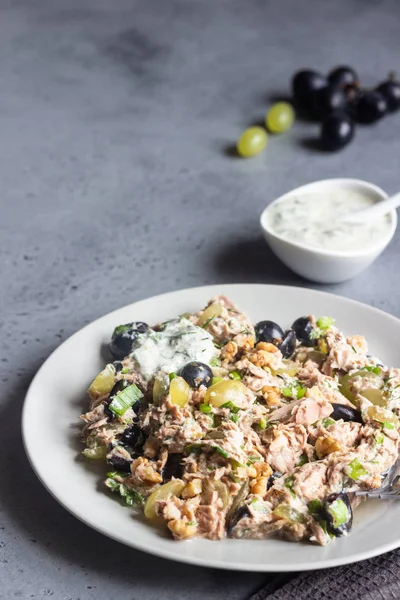 Tuna, green and black grapes salad with natural yogurt dressing. Healthy or food. Light breakfast, lunch or dinner.
