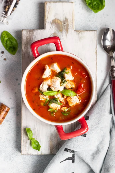 Warm tomato soup with chicken, vegetables and basil. Light concrete background. Copy space. Top view. — Stock Image Warm Tomato Soup Chicken Vegetables Basil Light Concrete Background Copy Royalty Free Stock Images