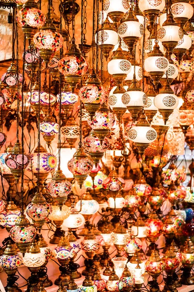 Colorful authentic and traditionally handmade lanterns, chandeliers or mosaic lamps selling on the Turkish Grand Bazaar in Istanbul, Turkey. Turkish or moroccan culture. Handmade lighting.