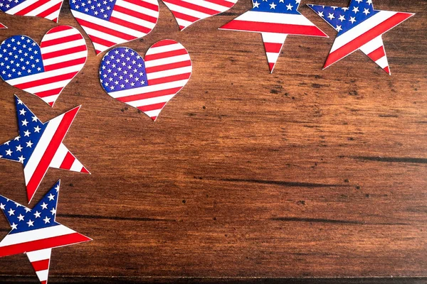 American Independence day background with blue, white and red mixed stars and hearts. Celebration of American independence day, the 4th of July (the Fourth of July). Holiday concept. With copy space.
