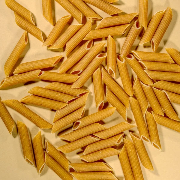 Raw Dried Uncooked Wholewheat Penne Pasta — Stock Photo, Image