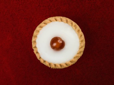 Individual Iced Bakewell Tart Topped With a Cherry clipart