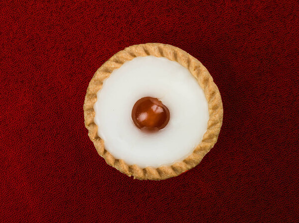 Individual Iced Bakewell Tart Topped With a Cherry