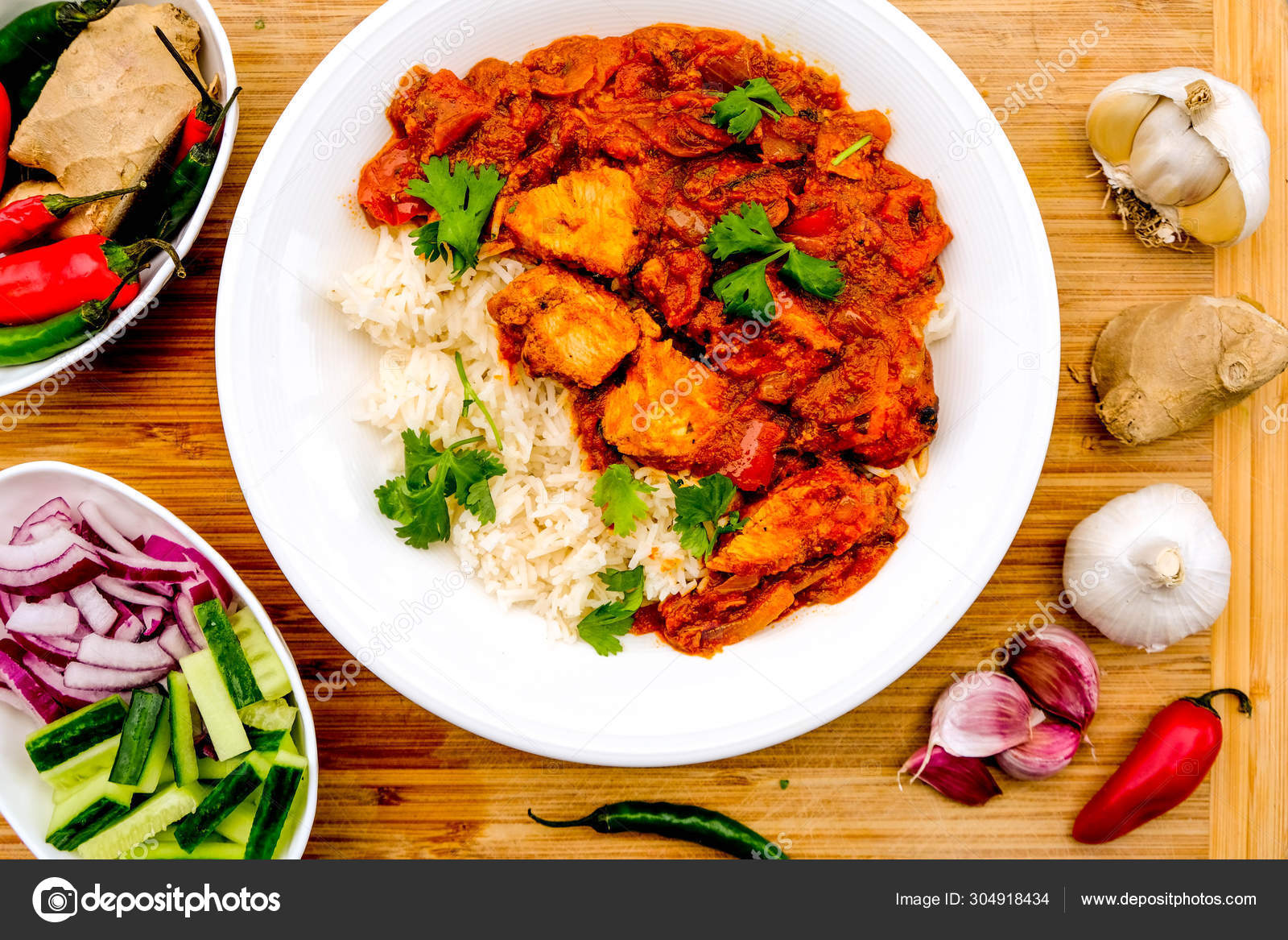 Indian Style Chicken Jalfrezi Curry With Rice Stock Photo by