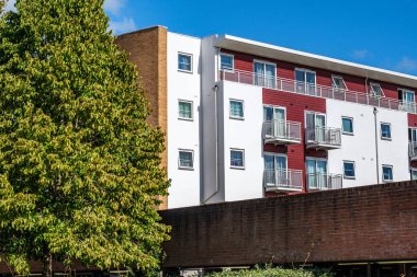 London UK, September 22 2025, A Block of Modern Apartment Against A Clear Blue Sky