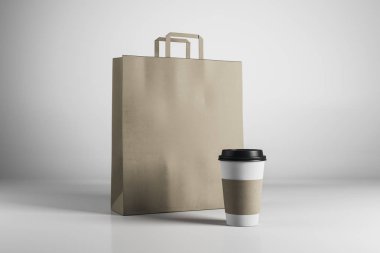 Boş kahverengi kağıt alışveriş çantası ve beyaz arka plan üzerinde kahve fincanı. Gıda take away kavramı. Alay etmek yukarıya, 3d render 