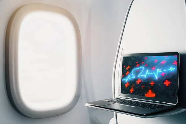 Ноутбук крупным планом внутри самолета с фотографией здоровья сердца на экране. Концепция медицинского образования. 3d-рендеринг . — стоковое фото