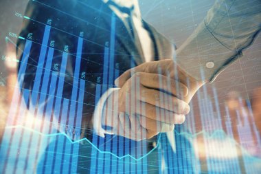 İki işadamı el sıkışması ile Cityscape arka planda mali grafik çift pozlama. Finansal analiz ve yatırım fırsatları konsepti