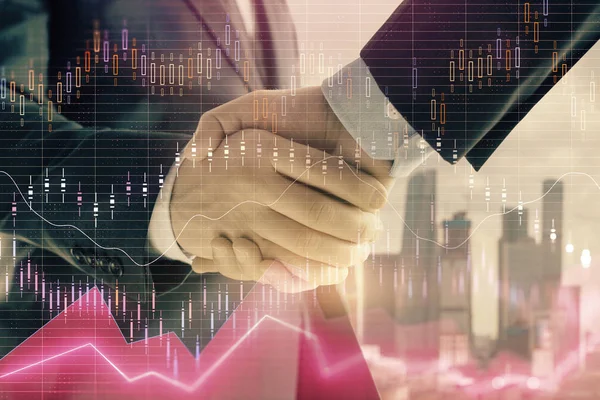 Double exposure of financial graph on cityscape background with two businessman handshake. Concept of stock market deal