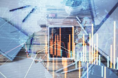 Masa arka planında yer alalı dijital tablette forex grafiği nin ve dünya haritasının çift pozlaması. Piyasa analizi kavramı