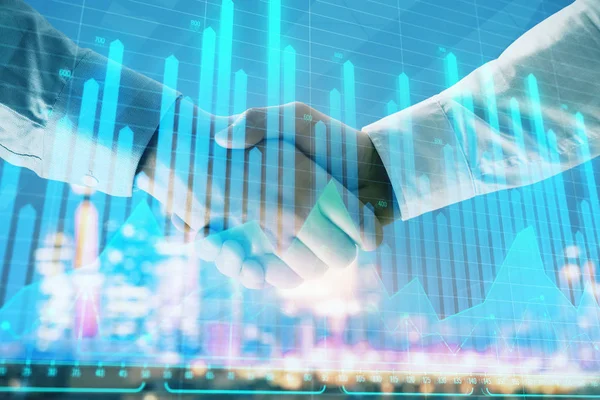 Double exposure of financial chart on cityscape background with two businessmen handshake. Concept of financial analysis and investment opportunities