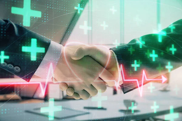 Multi exposure of heart icon hologram on office background with two men handshake. Concept of medical education — Stock Photo, Image