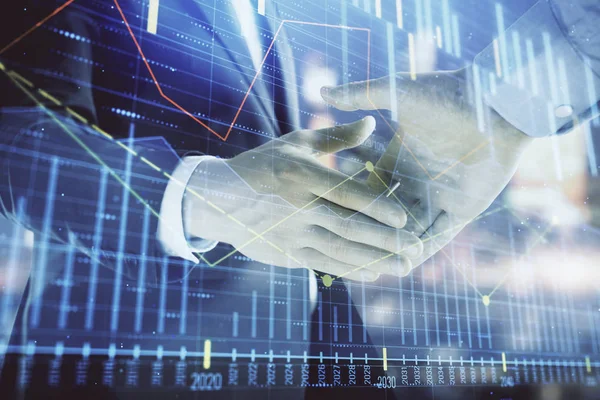 Double exposure of financial chart on cityscape background with two businessmen handshake. Concept of financial analysis and investment opportunities