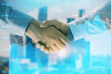 İki işadamı el sıkışması ile Cityscape arka planda mali grafik çift pozlama. Hisse senedi piyasası anlaşması kavramı