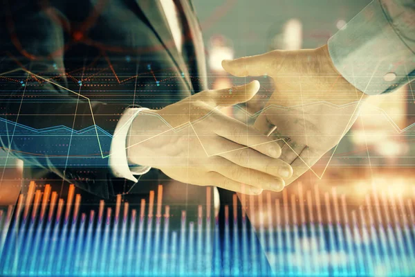 Double exposure of financial chart on cityscape background with two businessmen handshake. Concept of financial analysis and investment opportunities