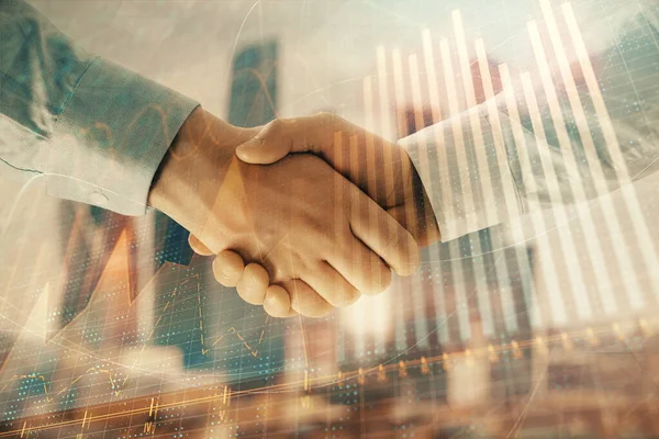 Double exposure of financial graph on cityscape background with two businessman handshake. Concept of stock market deal — Stock Photo, Image