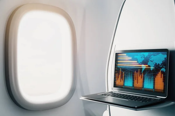 Ноутбук крупным планом внутри самолета с форекс график и карта мира на экране. Концепция торговли на финансовом рынке. 3d-рендеринг . — стоковое фото