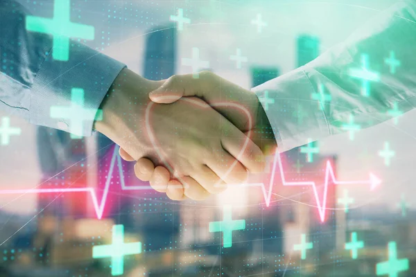 Double exposure of heart drawing on city view background with handshake. Concept of medical education — Stock Photo, Image
