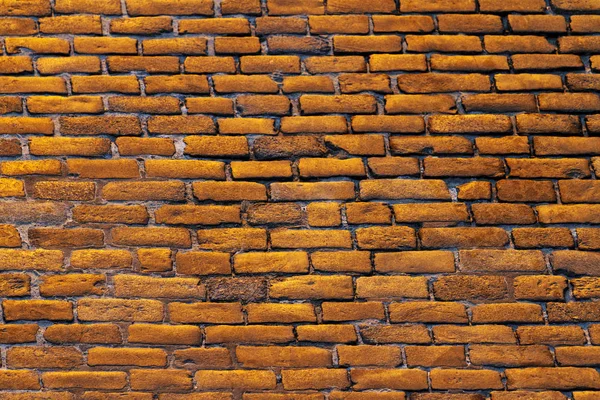 golden blocks are stacked in the wall