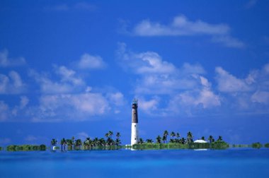 Located in Dry Tortugas National Park, around seventy miles west of Key West, Florida, Loggerhead Lighthouse on Loggerhead Key is considered one of the most isolated lighthouses in the United States clipart