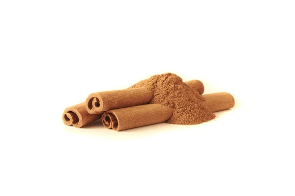 Cinnamon sticks and powder on white background — Stock Photo, Image