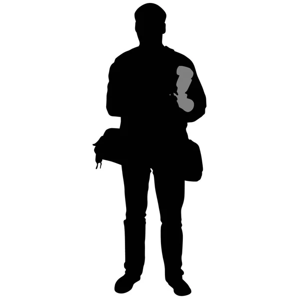 Silhouette of a man with camera and flash — Stock Vector