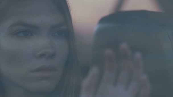 A sad girl puts her hand to the skeleton and looks at it, Melancholy — Stock Video