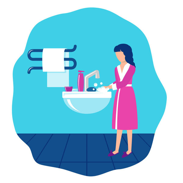 Девушка в ванной у раковины моет руки с мылом
