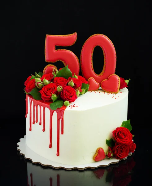 Sponge cake for his birthday on a black background.