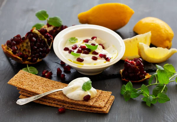 The sauce (dip) of yogurt with pomegranate and mint