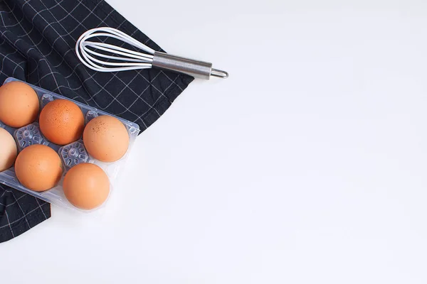 Raw Eggs Whisk Checkered Black Napkin Minimal Picture White Background — Stock Photo, Image